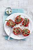 Red peppers filled with bulgur wheat, raisins and pine nuts, served with mint yoghurt