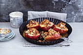 Baked apples with a quinoa and marzipan filling and flaked almonds