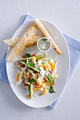 Egg salad with vegetables, blue cheese dressing and toast