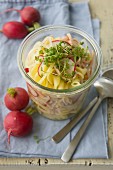 Pasta salad with radishes and strips of Lyon ham