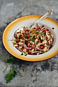 Turkish cannellini bean salad with red onions, pointed peppers and tahini