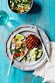 Grilled pork chops with salad and guacamole (Mexico)