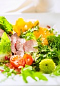 Colourful salad with duck breast