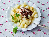 Steamed, diced pear with chocolate and quark cream