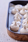 Meringues on a baking tray (close-up)