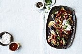 Aubergine salad with dried tomatoes, chickpeas and dates
