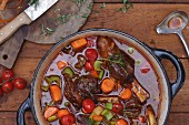Vegetable stew with leg of lamb and rosemary