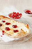 A quark pastry boat with redcurrant jelly