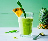 A spring smoothie made with pineapple and wild herbs