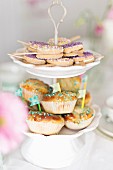 Biscuit lollies and and buns on a cake stand