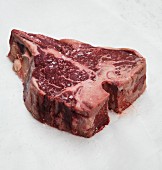 A raw beef steak with salt