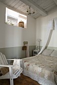 Vintage bedspread on double bed below small bed crown in simple bedroom