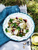 Salad with poached leek, radish, walnut and goat cheese
