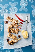 Spicy squid skewers with quince aioli