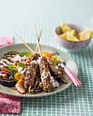 Oriental spiced minced beef skewers with a side of vegetables