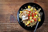 Mahi-mahi with quinoa, pineapple and peppers (seen from above)