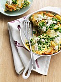 Potato frittata with goat's cream cheese, spinach and peas