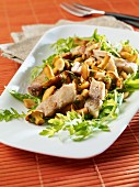 Soused herring with chanterelle mushrooms on a bed of rocket
