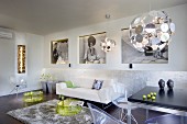 Plexiglas shell chairs, translucent yellow tray tables and classic Dandelion pendant lamp in modern interior