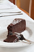 A Slice of Chocolate Cake on a Black Background