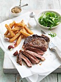 Beef steak with chips and rocket