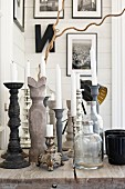 White candles in candlesticks on wooden table