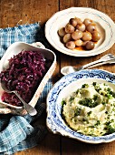Mashed potatoes with green kale and pickled onions