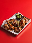 Glazed chicken legs with limes