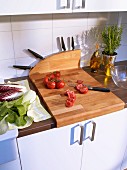 Chopping board with additional knife block in kitchen
