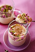 Chai tea panna cotta with rose buds and pistachios