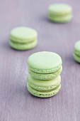 Pistachio macaroons on a wooden surface