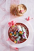 Rice paper spring rolls with flowers and a coconut and ginger dip
