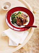Veal steaks with olives and spinach