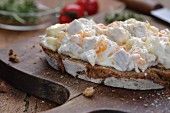 A slice of bread topped with chicken salad