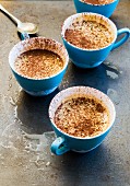 Frozen sabayon with cocoa powder in blue cups