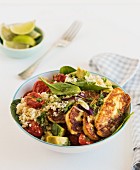 Halloumi with couscous, avocado and tomatoes