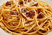 Spaghetti with a minced meat sauce and Parmesan (close-up)