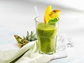 A spinach smoothie with exotic fruits
