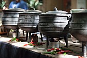 Cooking pots and chilli peppers at a market