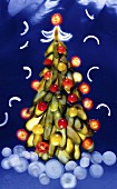 A Christmas tree made from gherkins, cherry tomatoes and onions