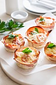 Baked eggs wrapped in smoked salmon with parsley