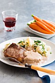 Steak Diana with mashed potatoes and carrots