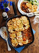 Oven-roasted beef with beans and a potato topping