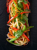Pepper salad with carrots and coriander leaves (seen from above)