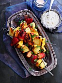 Fruit skewers with a passion fruit dip