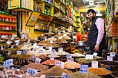 A street vendor in his spice shop in Delhi, India