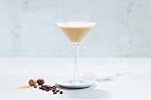 A martini cocktail with coffee and nutmeg