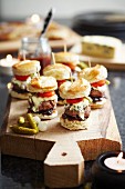 Mini burgers with blue cheese, gherkins, sweet onions, relish and tomatoes