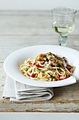 Linguine with crab, tomatoes, courgette and grated cheese