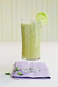 A glass of cucumber and mint smoothie